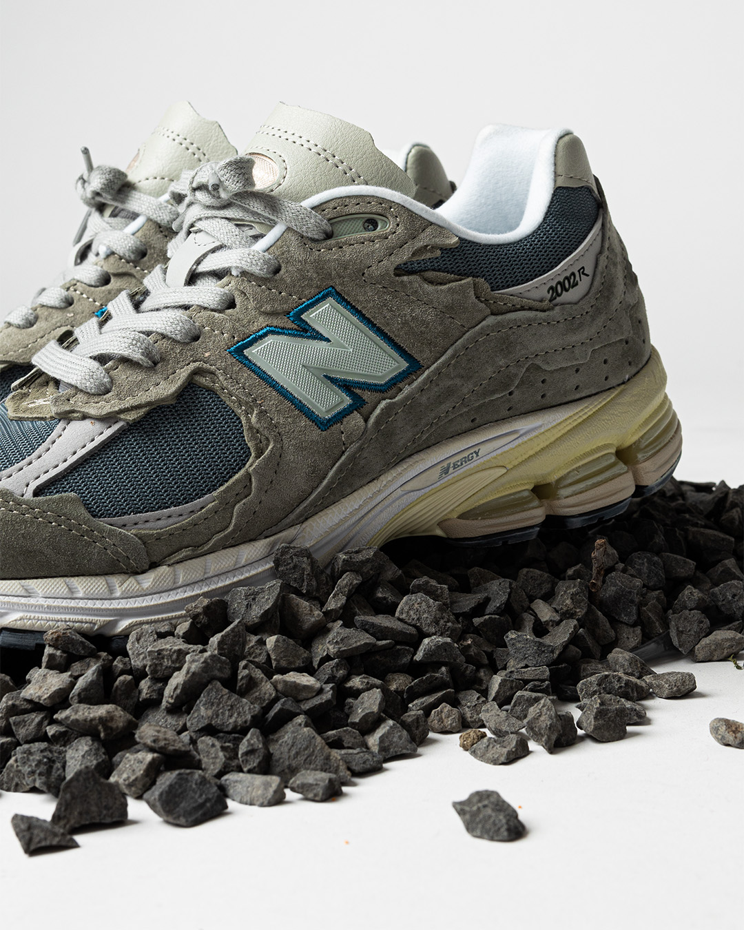 New Balance Protection Pack M2002RDD Mirage Grey on stones