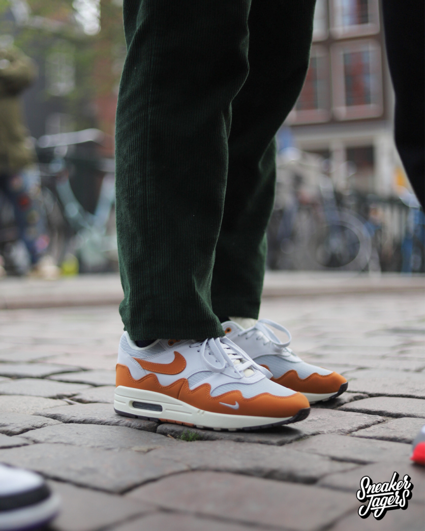 outside patta amsterdam for patta x nike air max 1 monarch the wave release - the shoe on feet